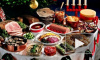 Хозяйки готовят салаты на Новый год 2015, самые популярные "Крабовый", "Цезарь с курицей", "Гранатовый браслет"