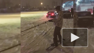 В Приморском районе петербуржец прокатился на сноуборде по парковке